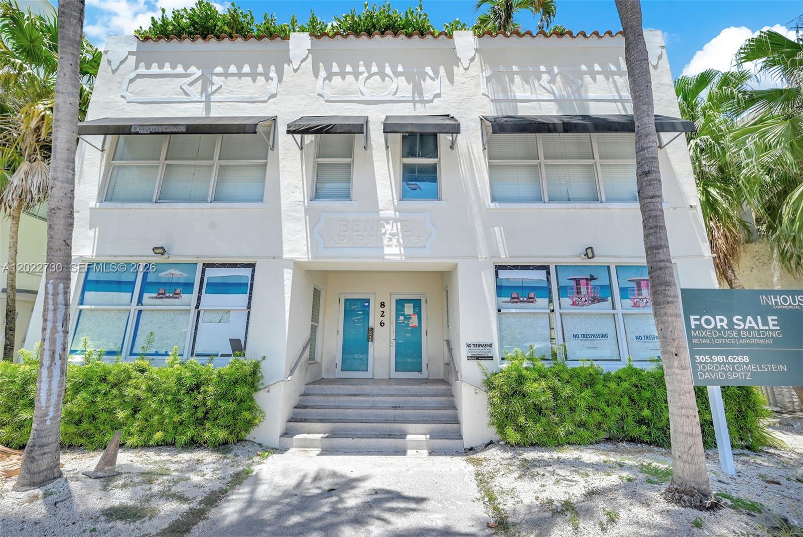 A two-story white stucco building with black awnings and a for sale sign — 826 Collins Ave, Miami Beach FL 33139, MIAMI BEACH, FL