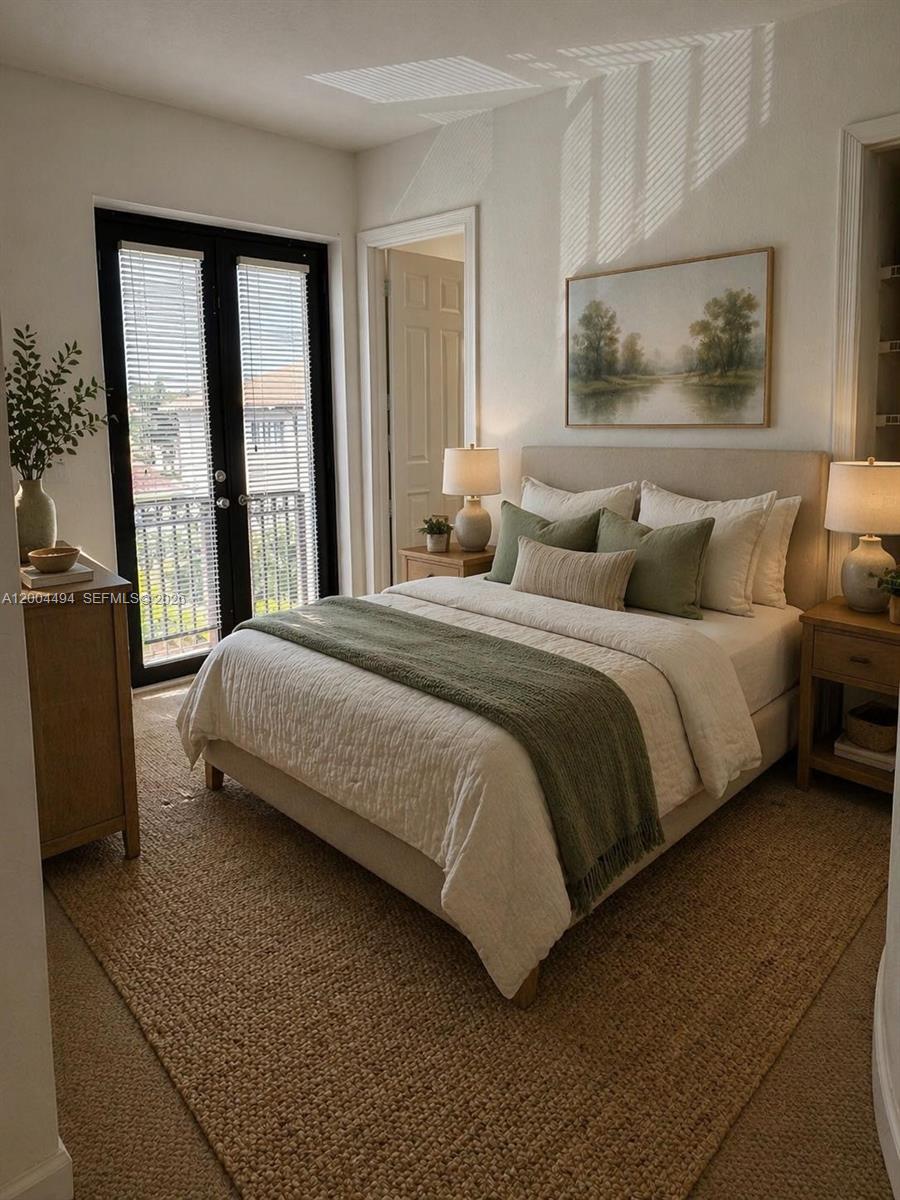A bedroom features a bed with green accents, a jute rug, and a balcony door — 7441 SW 187th St, Cutler Bay FL 33157, CUTLER BAY, FL