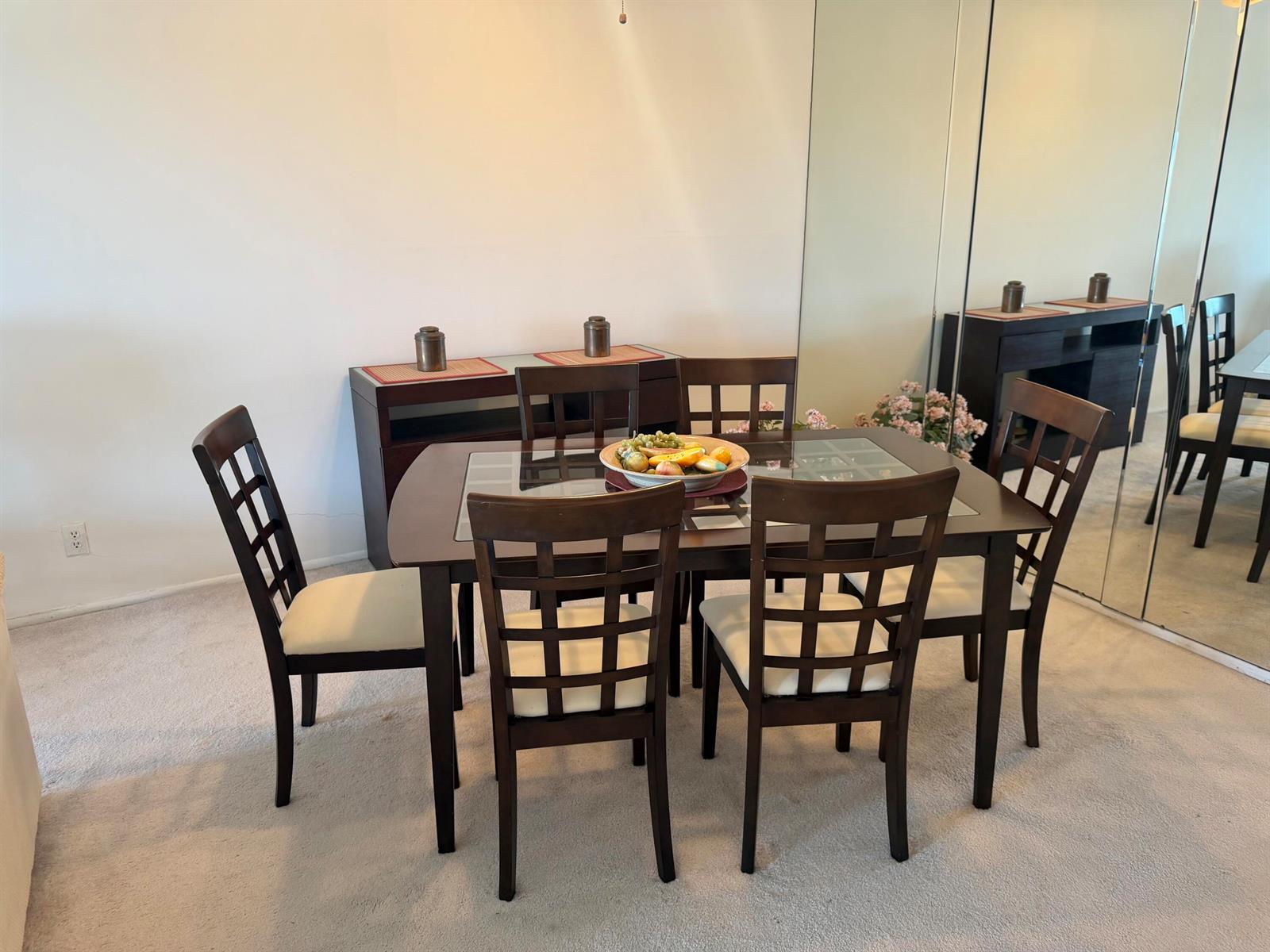 A dining room features a dark wood table with four chairs and a matching sideboard — 3150 N Palm Aire Drive # 804, Pompano Beach FL 33069, POMPANO BEACH, FL