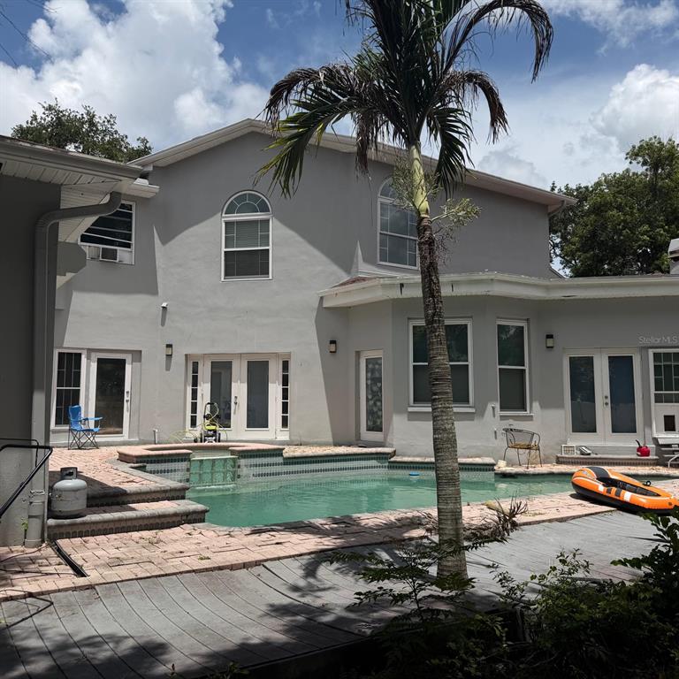 A two-story house with a swimming pool, a palm tree, and a wooden deck — 1931 OAK RIDGE COURT, CLEARWATER, FL