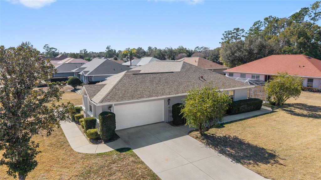 An aerial view shows a single-story house with a garage, driveway, and surrounding lawn — 4560 NW 5TH COURT, OCALA, FL