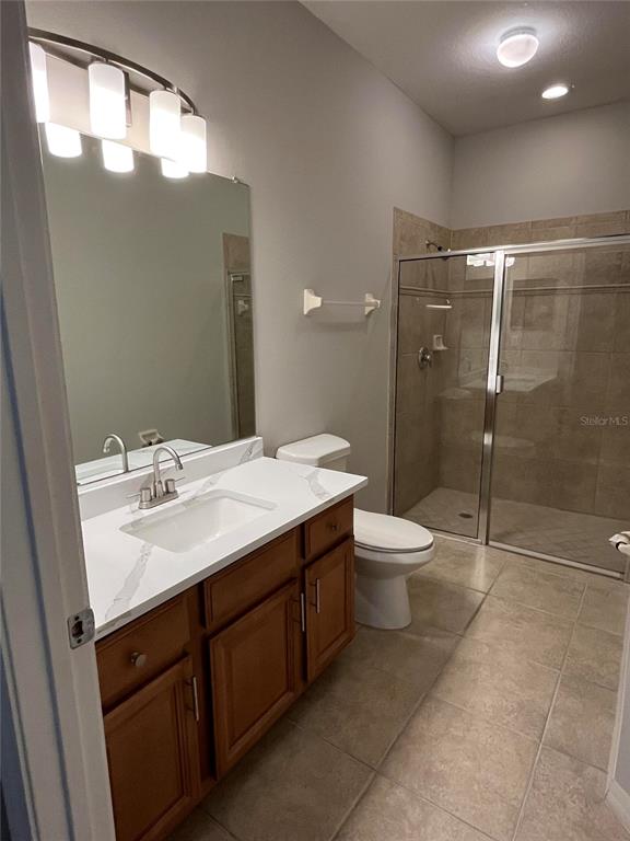 An arched entryway features a brown door and a red fire extinguisher box on the wall — 3635 PARKRIDGE CIRCLE UNIT 10-101, SARASOTA, FL