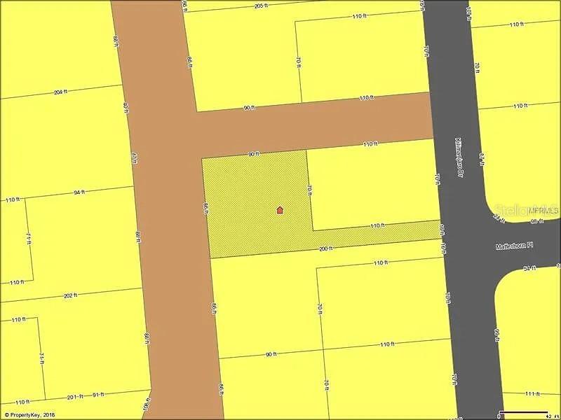 This is a property map showing a highlighted rectangular lot with dimensions in feet — 546 KILIMANJARO DRIVE, KISSIMMEE, FL