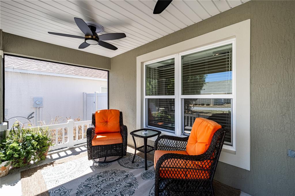 A screened-in patio features a dining set, lounge chairs, and a small swimming pool — 5288 HURTT STREET, THE VILLAGES, FL