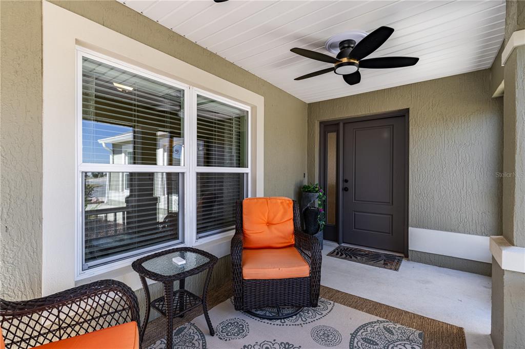 A screened-in patio features a small swimming pool and two lounge chairs — 5288 HURTT STREET, THE VILLAGES, FL