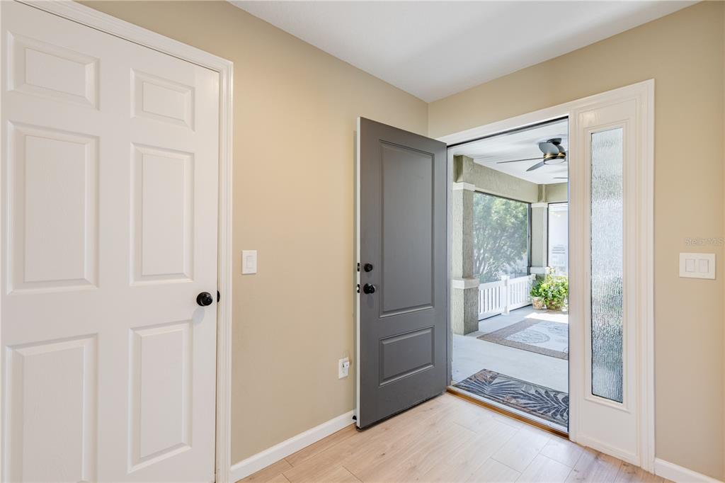 A screened-in patio features a rectangular swimming pool, lounge chairs, and an outdoor dining set — 5288 HURTT STREET, THE VILLAGES, FL