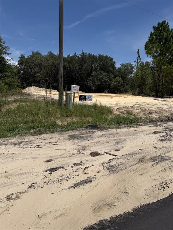 A vacant, sandy construction lot features a prepared foundation and a utility pole — 6603 N BEDSTROW BOULEVARD, CITRUS SPRINGS, FL