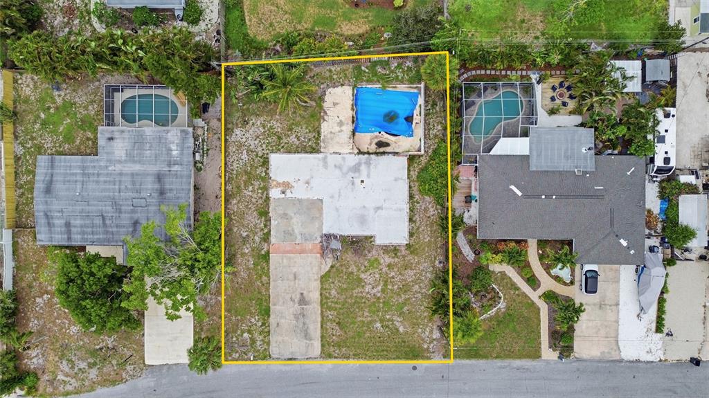 An aerial view shows a rectangular residential lot containing a house foundation and a pool — 1308 62ND STREET NW, BRADENTON, FL