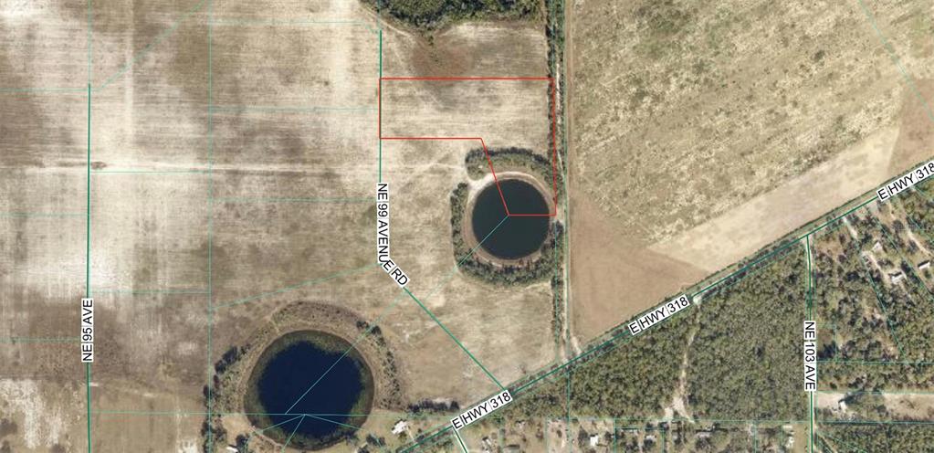 This aerial map shows a parcel of land with a pond near a road intersection — 23535 NE 99TH AVENUE ROAD, CITRA, FL