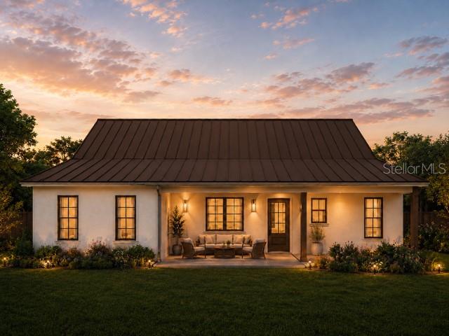 This is a rendering of a one-story house exterior with a metal roof and porch — 6801 BALSAM PLACE, SEBRING, FL