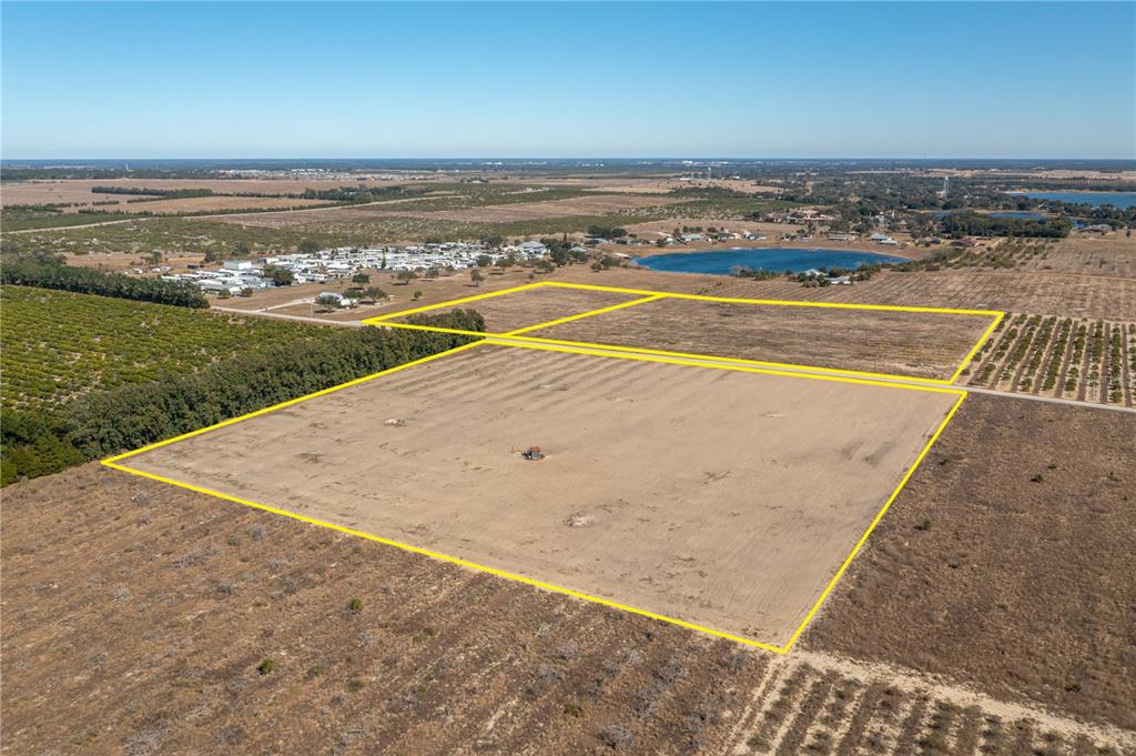 An aerial view shows two large, rectangular, cleared plots of land outlined in yellow — TOWNSEND ROAD, LAKE WALES, FL