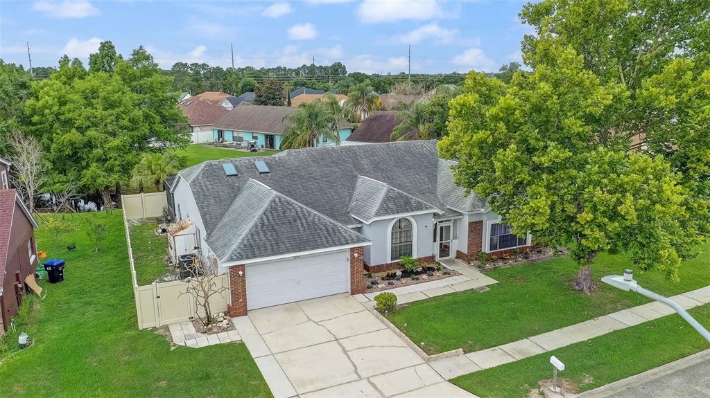 An aerial view of a single-story house with a gray roof and a concrete driveway — 2358 OLDFIELD DRIVE, ORLANDO, FL