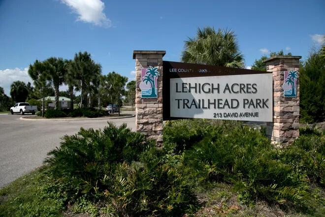 A stone monument sign marks the entrance to Lehigh Acres Trailhead Park — 1246 Cordoba Street E, Lehigh Acres FL 33974, LEHIGH ACRES, FL