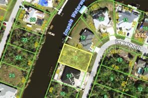 This is an aerial map showing a vacant residential lot highlighted in yellow along a canal — 9186 IMPALA CIRCLE, PORT CHARLOTTE, FL