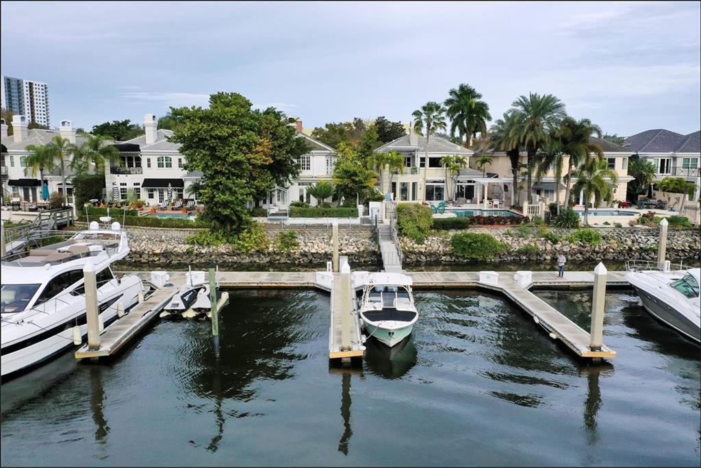 An aerial view of waterfront homes with private docks and boats on a canal — 60 MARINER WAY UNIT 60, TAMPA, FL