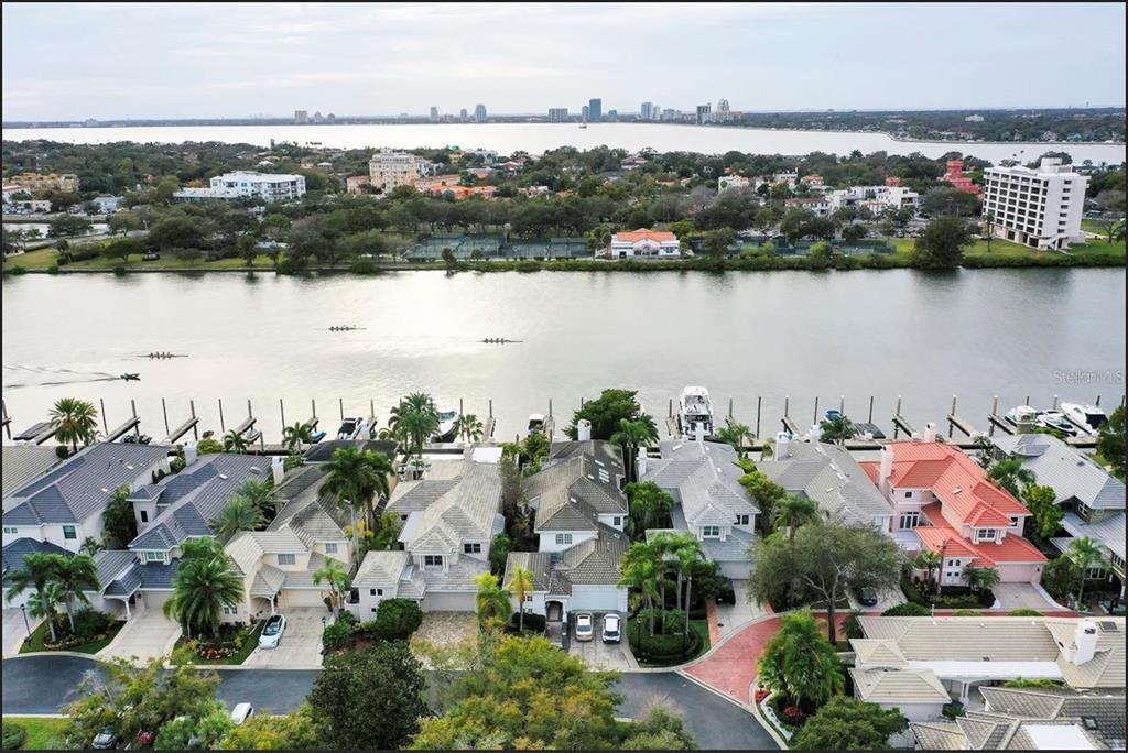 An aerial view of waterfront houses with private docks along a canal near a bay — 60 MARINER WAY UNIT 60, TAMPA, FL