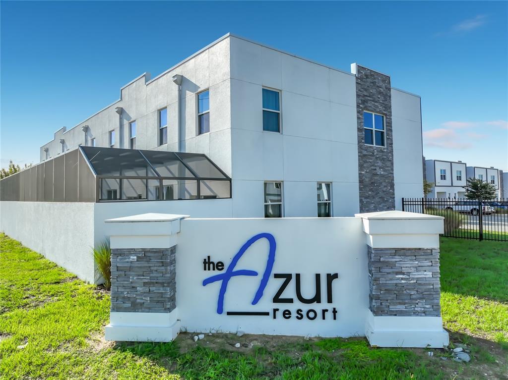 The exterior of a modern multi-story building features a prominent sign for The Azur Resort — 444 FAMAGUSTA DRIVE, DAVENPORT, FL