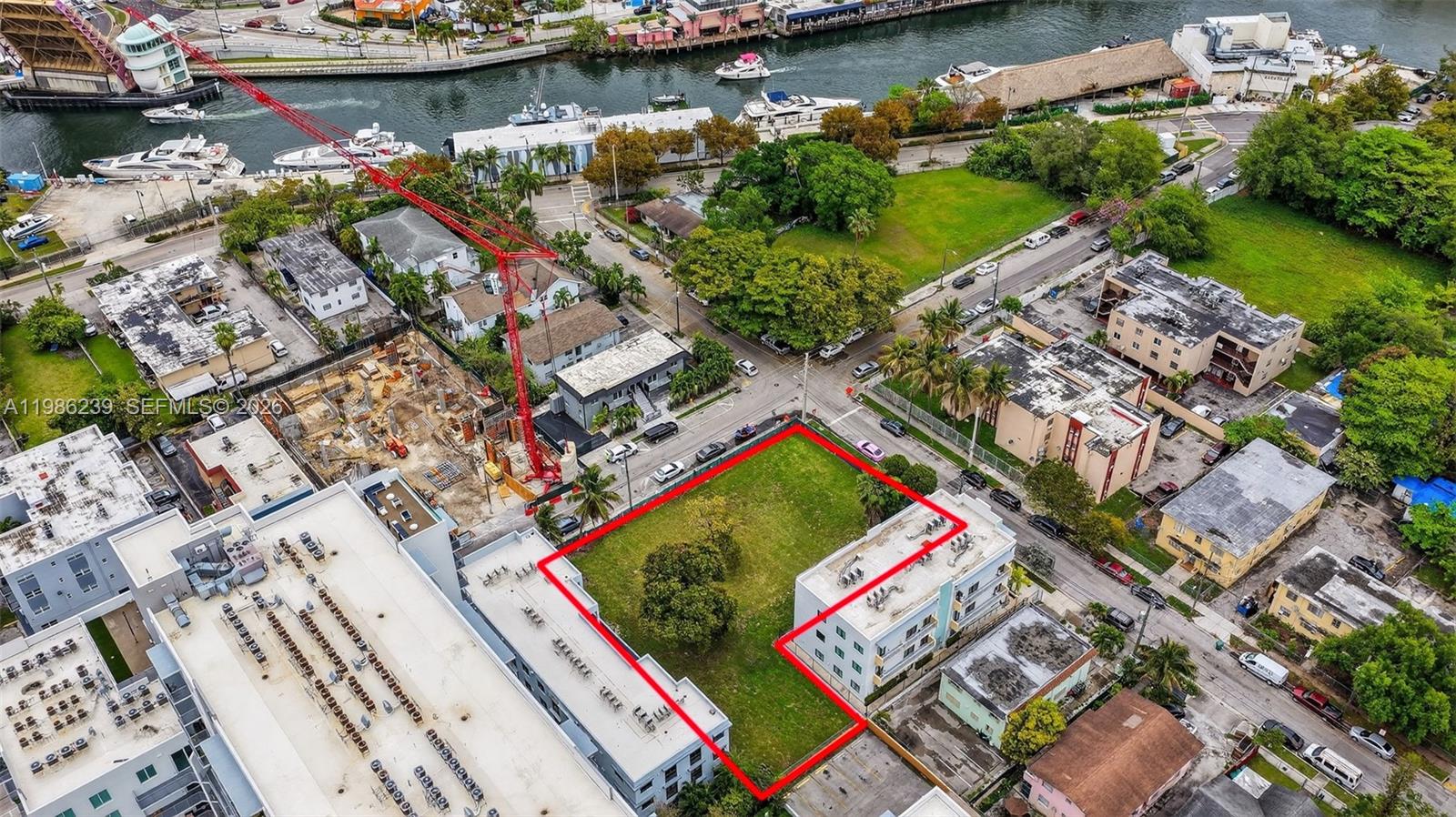 An aerial view shows a vacant rectangular lot outlined in red between existing buildings — 244 NW 7th Ave, Miami FL 33128, MIAMI, FL