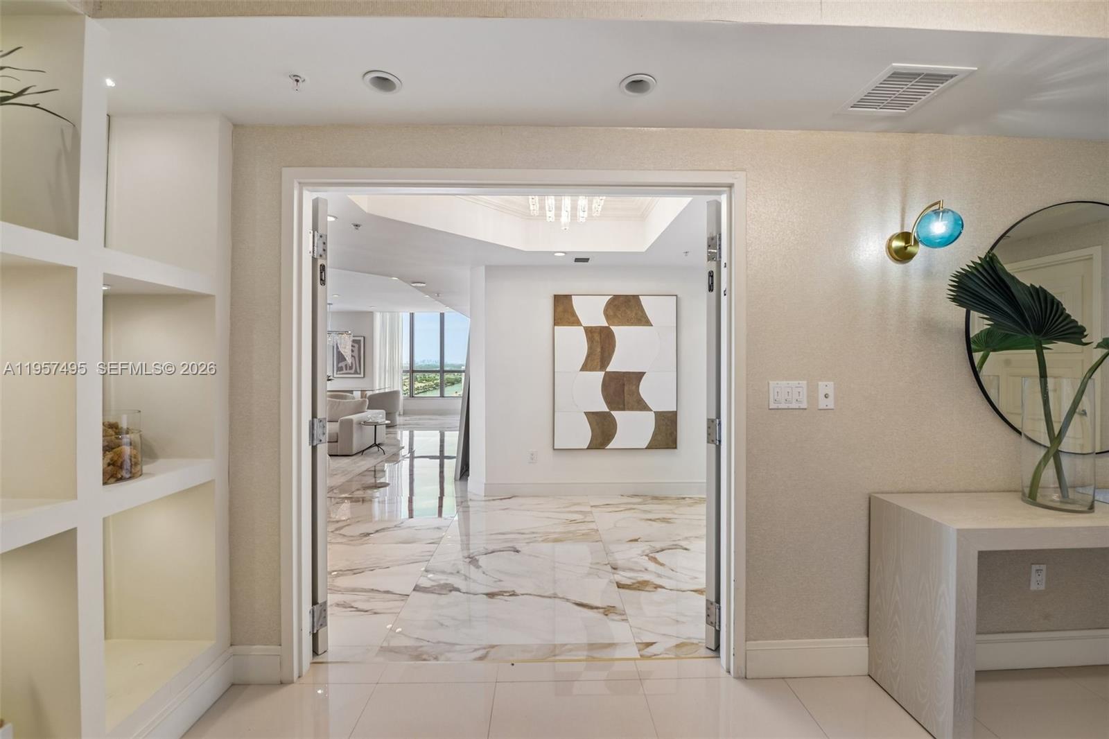 A doorway leads from a tiled foyer into a living area with marble floors — 3535 S Ocean Dr # 2106, Hollywood FL 33019, HOLLYWOOD, FL