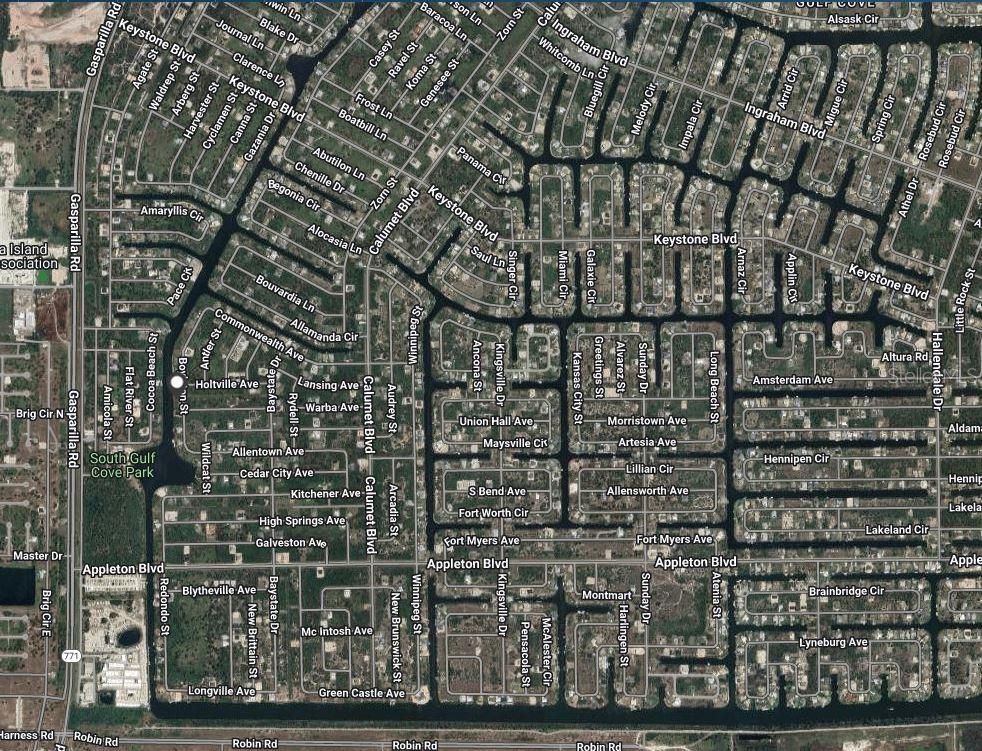 This is an aerial map showing the street layout and residential blocks of a neighborhood — 10091 BOYLSTON STREET, PORT CHARLOTTE, FL