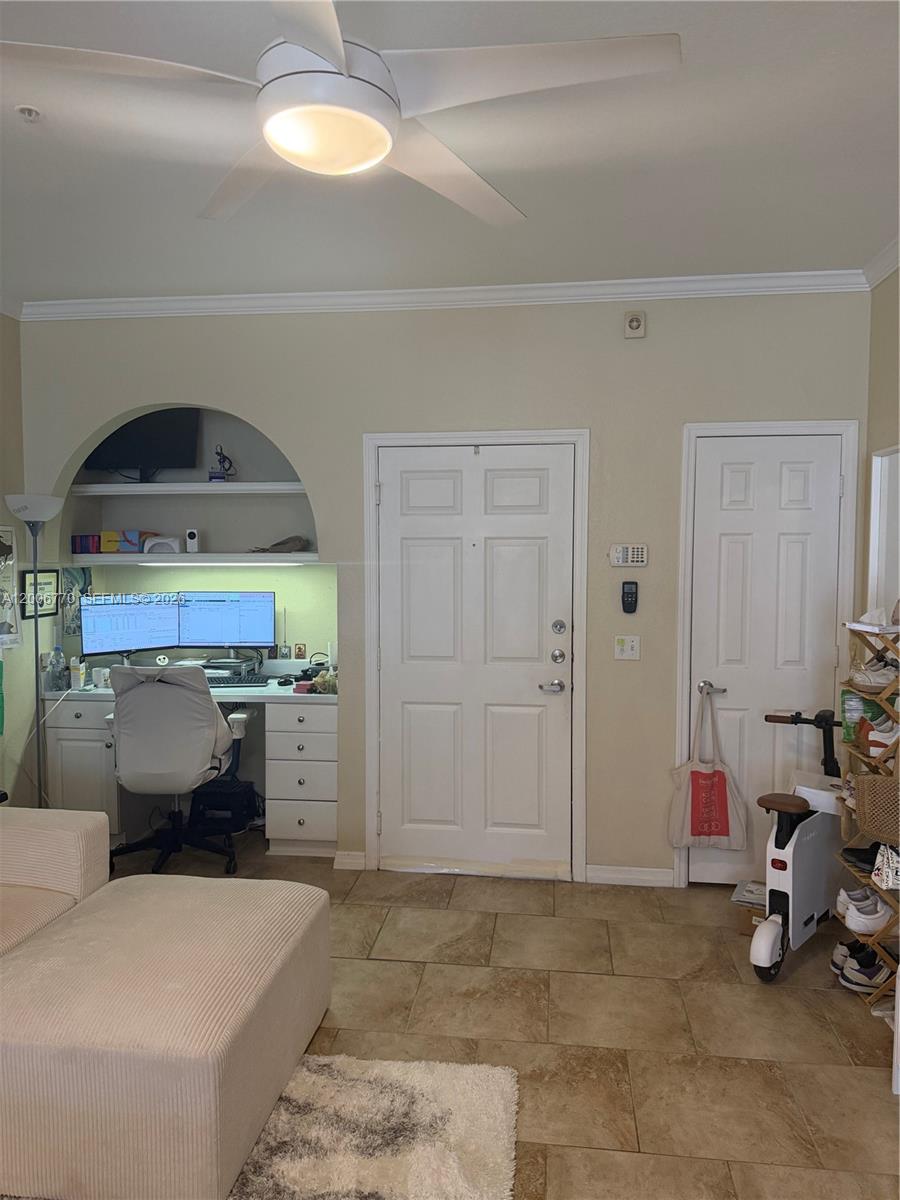 A room features a built-in desk under an arched alcove, a white door, and tile flooring — 860 N Orange Ave # 258, Orlando FL 33180, ORLANDO, FL