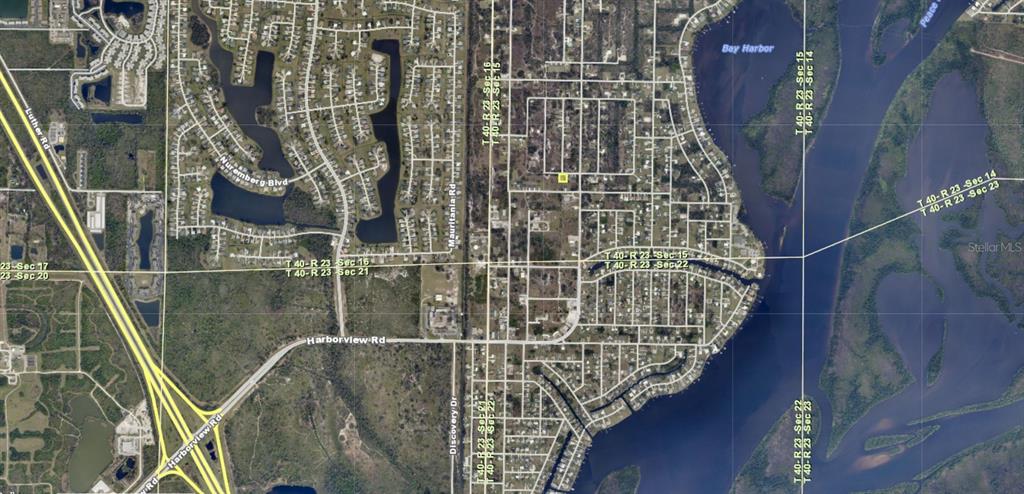 This is an aerial map showing residential streets, bodies of water, and land section markers — 27119 MONROE STREET, PUNTA GORDA, FL