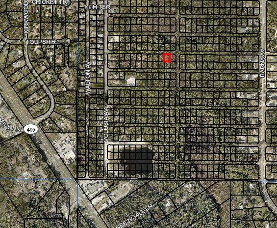 This is an aerial map showing a highlighted vacant lot within a residential neighborhood grid — Lot 2 VOLUSIA AVENUE, TITUSVILLE, FL