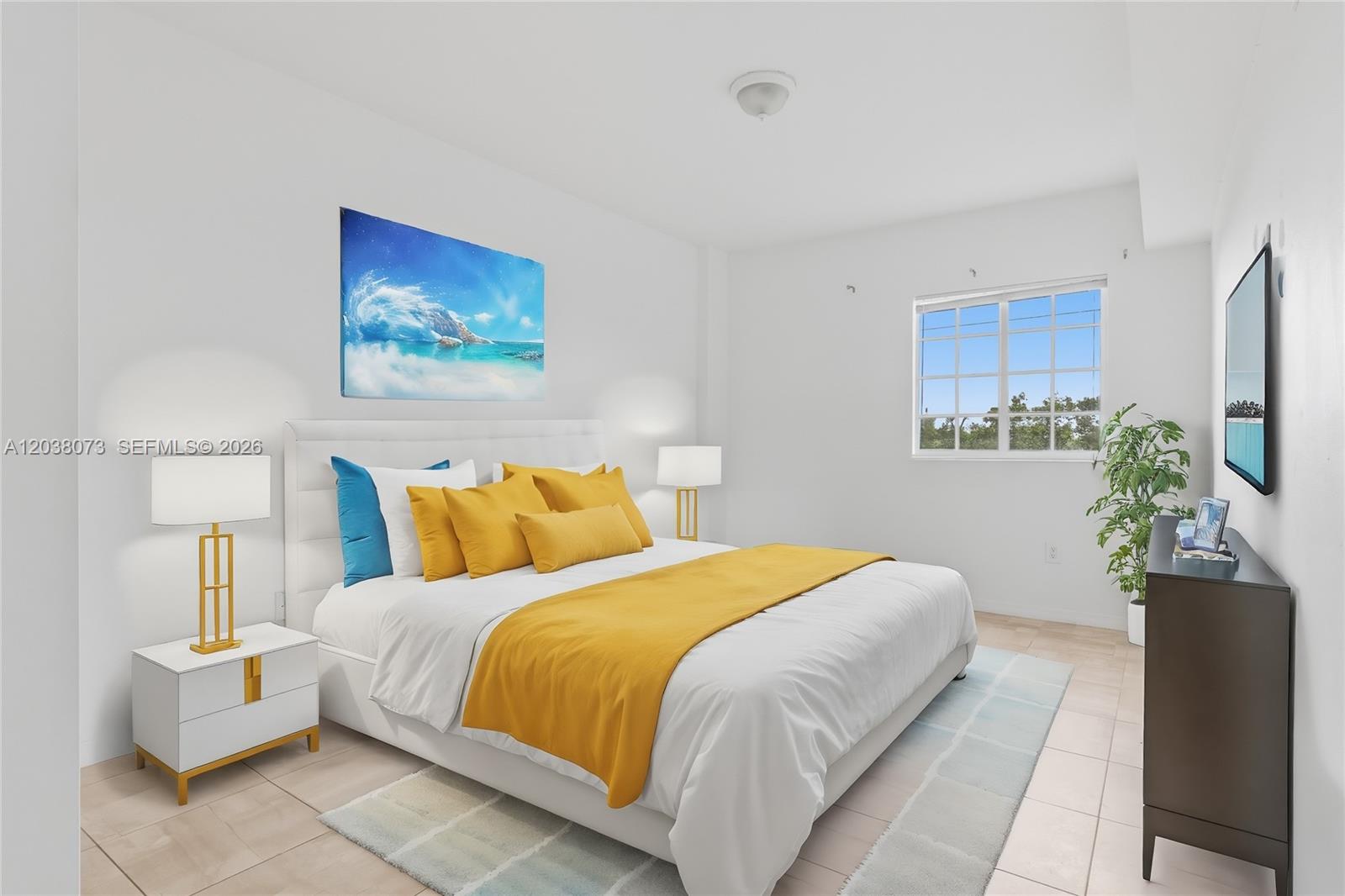 A bedroom features a white bed with yellow accents, two nightstands, and a wall-mounted television — 5271 SW 8th St # 304, Miami FL 33134, MIAMI, FL