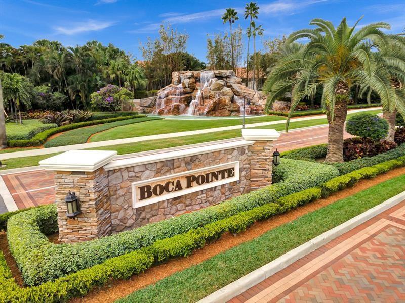 A stone monument sign for Boca Pointe stands before a landscaped garden with a waterfall — 6584 Via Regina, Boca Raton FL 33433, BOCA RATON, FL