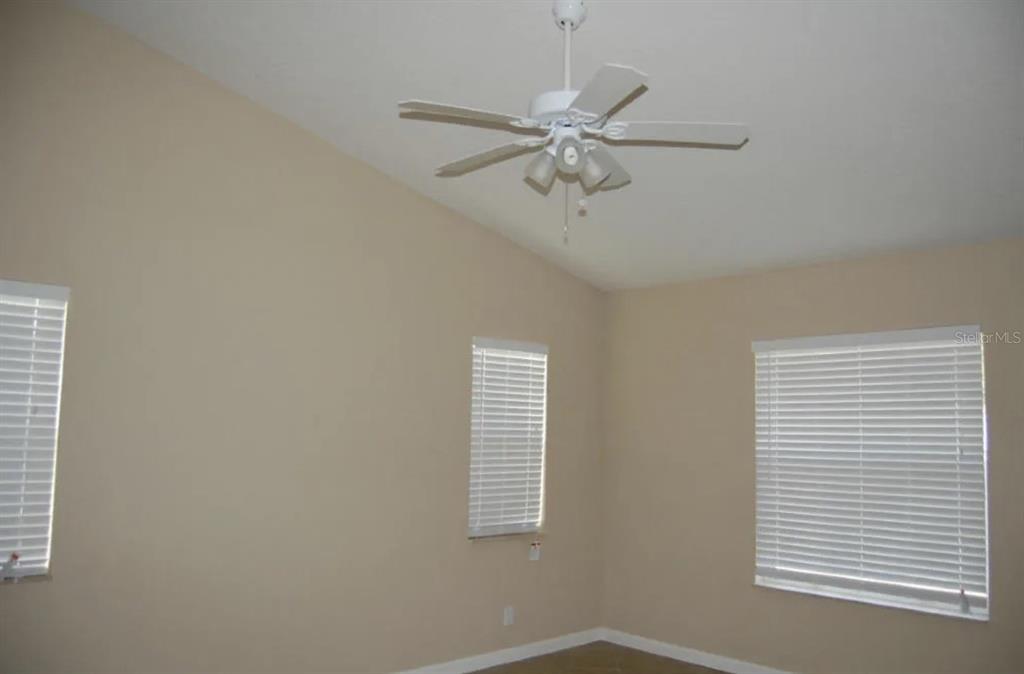 An empty room with beige walls, white blinds, and a ceiling fan — 926 SW 11TH TERRACE, DELRAY BEACH, FL