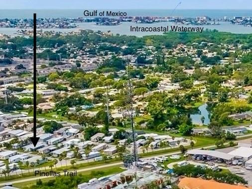 An aerial view shows a residential neighborhood near the Pinellas Trail, Intracoastal Waterway, and Gulf — 6580 SEMINOLE BOULEVARD UNIT 510, SEMINOLE, FL