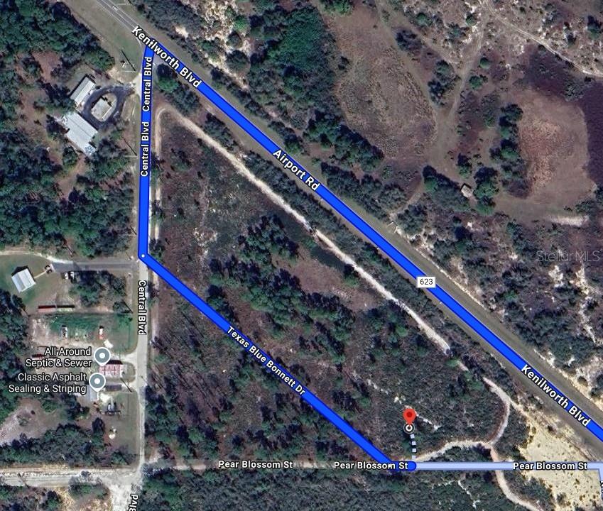 This is an aerial map showing a vacant lot bounded by several intersecting streets — 6115 PEAR BLOSSOM STREET, SEBRING, FL