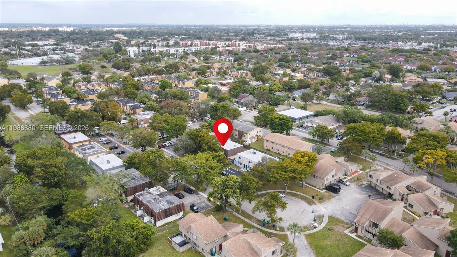 An aerial view shows a residential neighborhood with multi-family buildings, parking lots, and trees — 2260 NW 59th Way, Lauderhill FL 33313, LAUDERHILL, FL