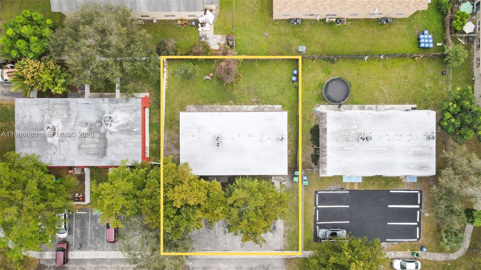 An aerial view shows a rectangular property lot outlined in yellow containing a building — 2260 NW 59th Way, Lauderhill FL 33313, LAUDERHILL, FL