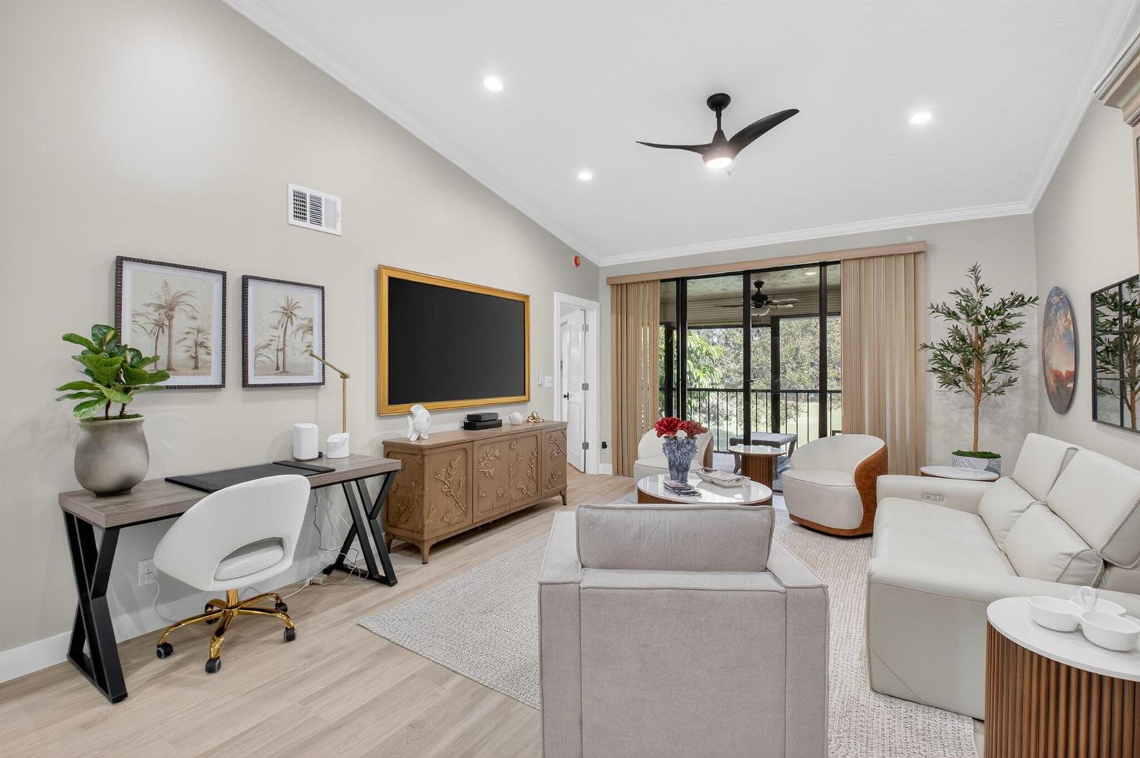 A living room features a desk, a television on a wooden console, and white furniture — 7455 Glendevon Lane # 206, Delray Beach FL 33446, DELRAY BEACH, FL