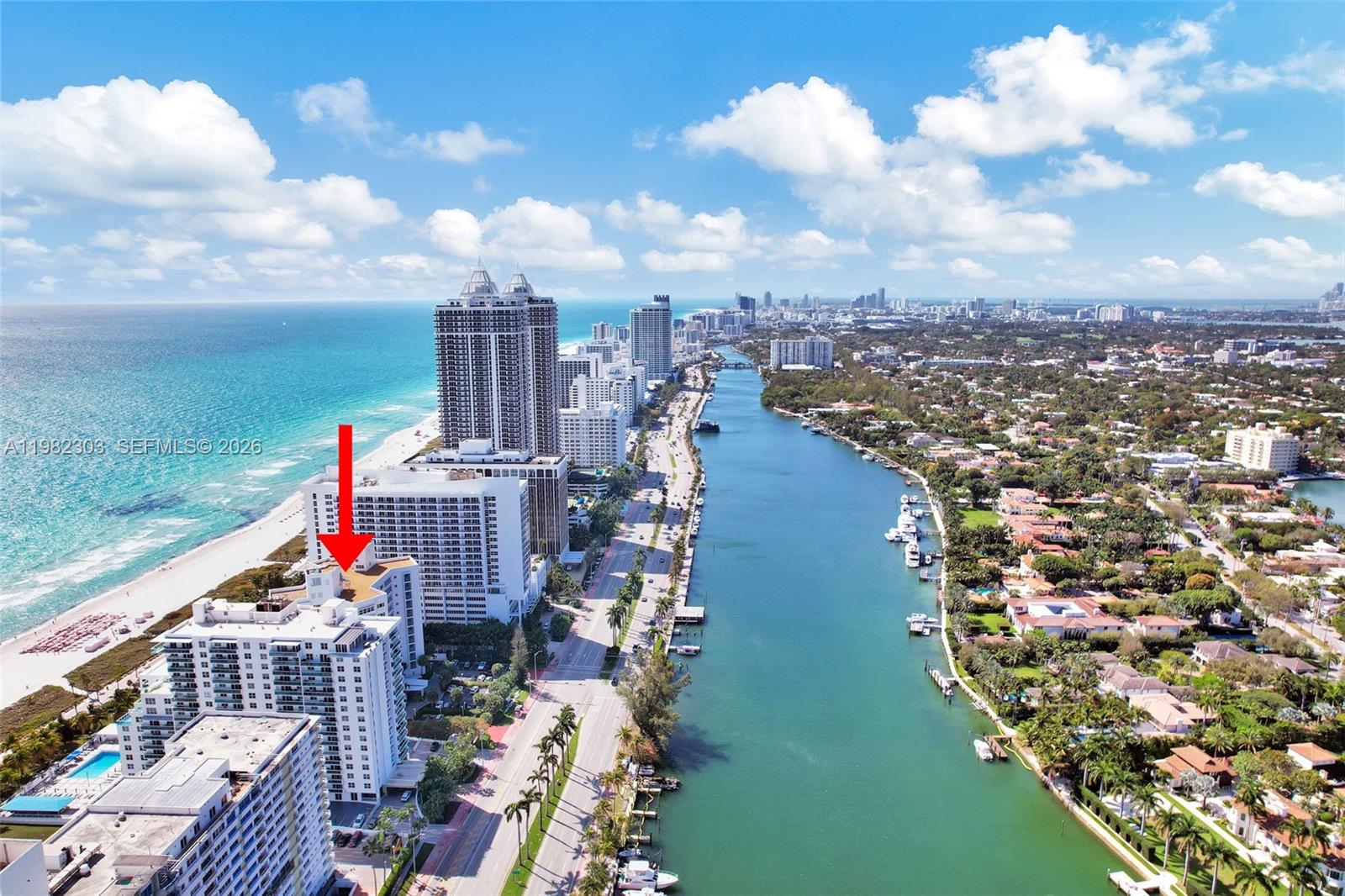 An aerial view shows high-rise residential buildings along a beach and a waterway — 4925 Collins Ave # 4A, Miami Beach FL 33140, MIAMI BEACH, FL
