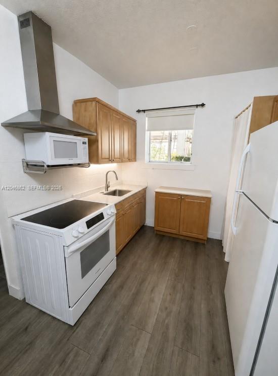 A kitchen features light wood cabinets, stainless steel appliances, and wood-look flooring — 1021 NW 3rd St # 106, Miami FL 33128, MIAMI, FL