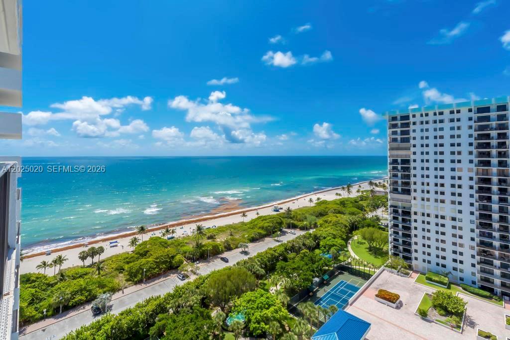 An elevated view shows a beach, ocean, coastal road, and a tall residential building — 1201 S Ocean Dr # 2003N, Hollywood FL 33019, HOLLYWOOD, FL
