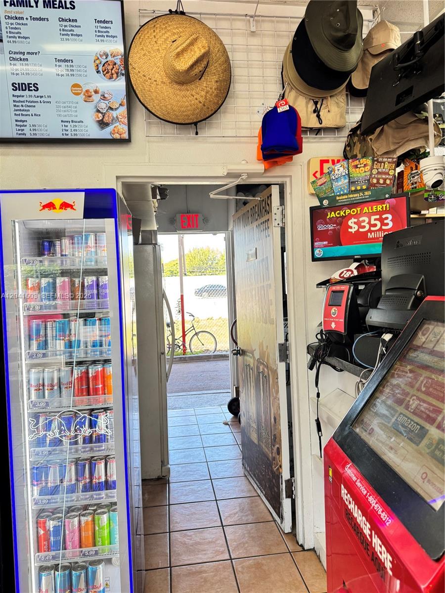 A convenience store interior features a refrigerated drink display, a food menu, and lottery displays — 6776 SW 117th Ave, Miami FL 33183, MIAMI, FL