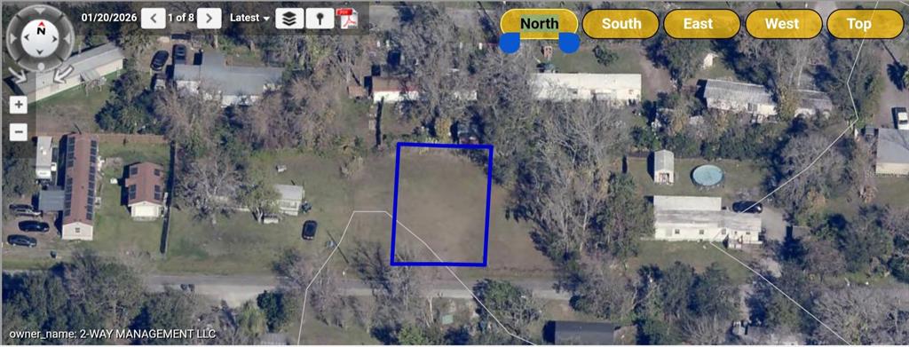 An aerial view shows a vacant rectangular lot outlined in blue within a residential neighborhood — 18643 15TH AVENUE, ORLANDO, FL