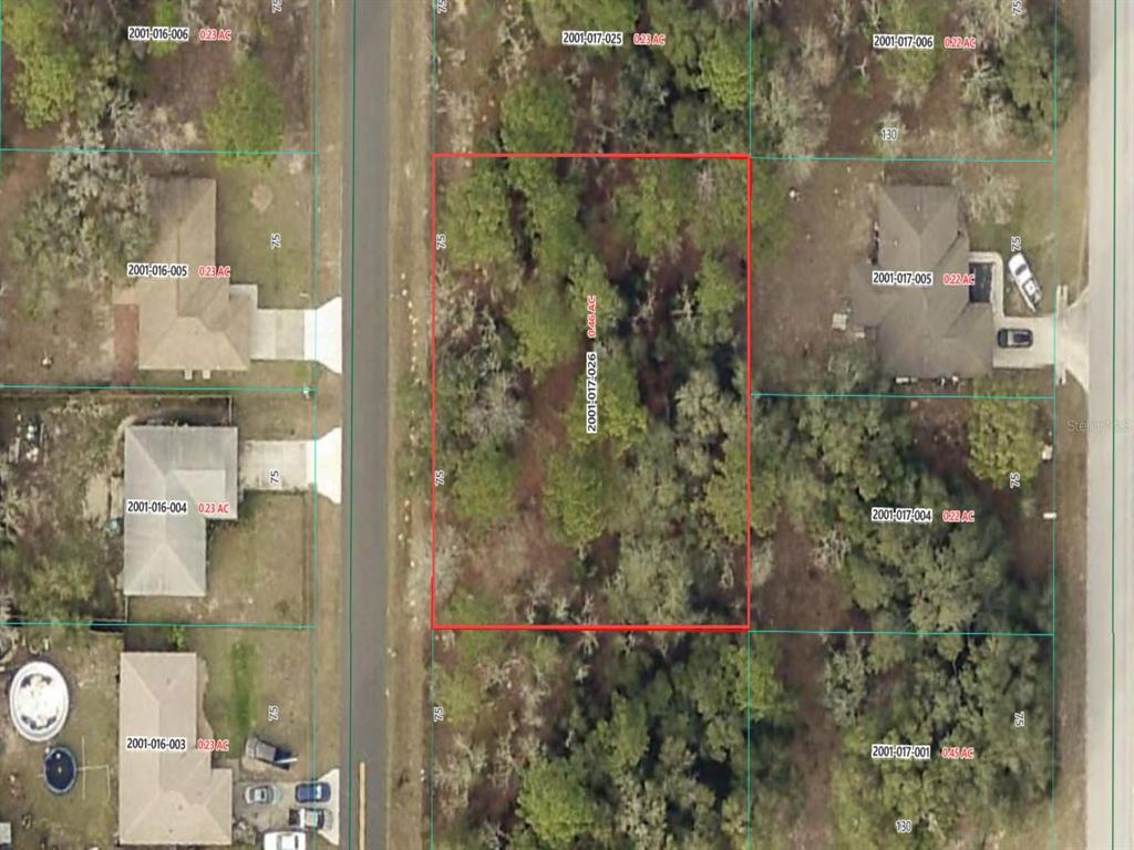 This is an aerial map showing a vacant, rectangular residential lot outlined in red — SW 140TH COURT, OCALA, FL