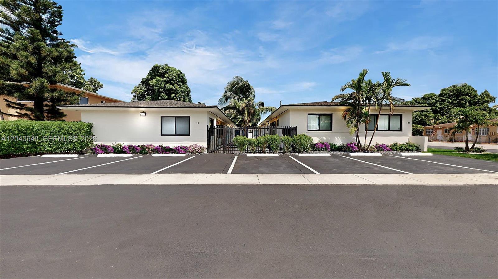 A single-story residential building with a parking lot in front and a gated entrance — 101 W 11th St # 4, Hialeah FL 33010, HIALEAH, FL