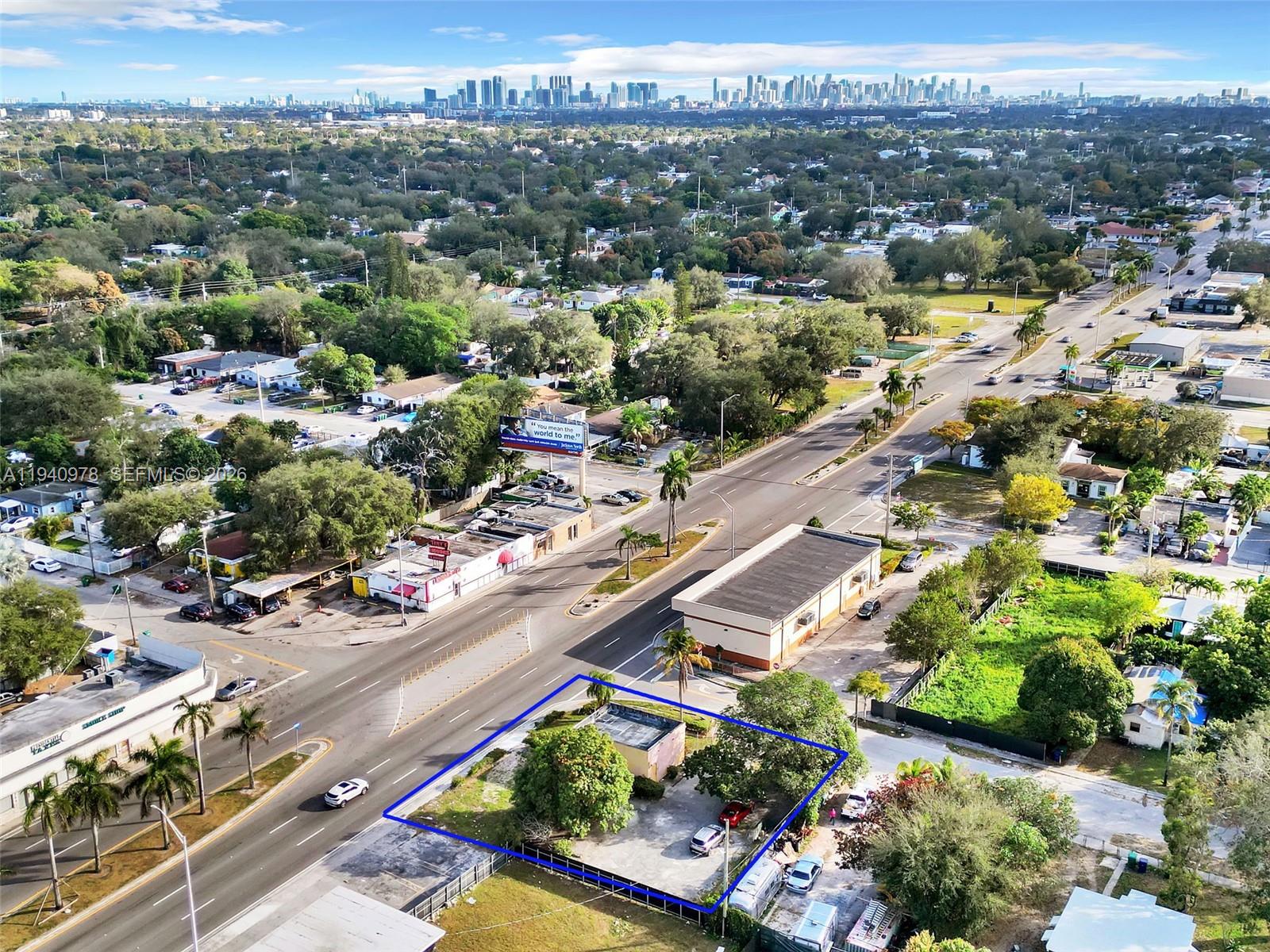 An aerial view shows a small commercial building on a corner lot with parking — 9200 NW 22nd Ave, Miami FL 33147, MIAMI, FL