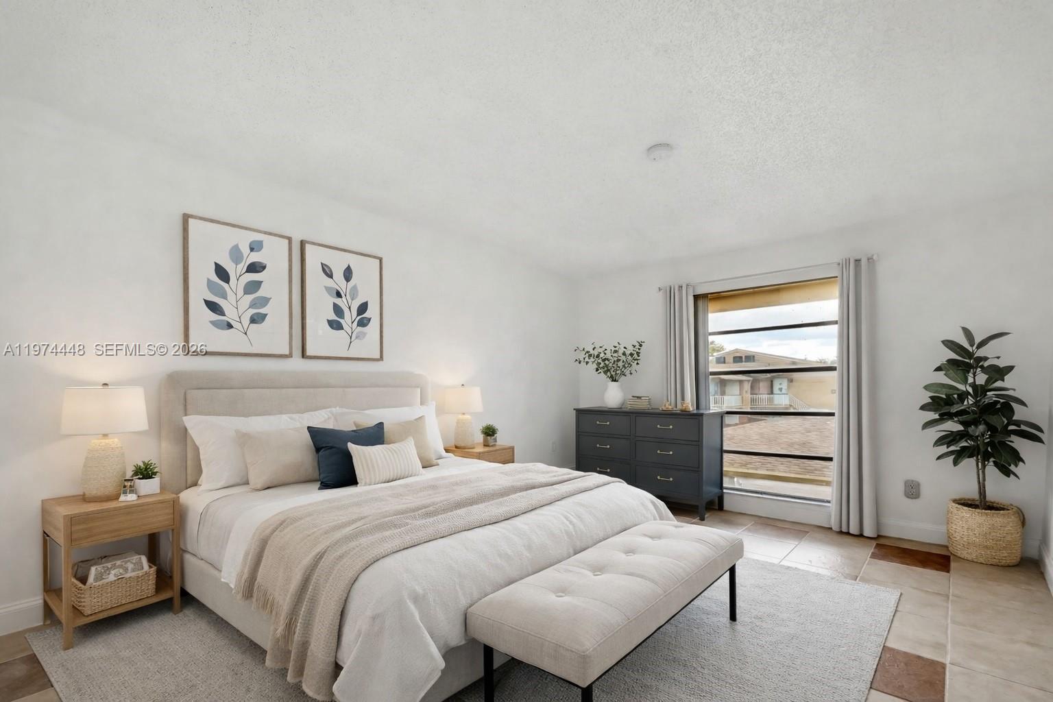 A bedroom features a bed with a neutral headboard, a dresser, and a window view — 13787 SW 66th St # 254D, Miami FL 33183, MIAMI, FL