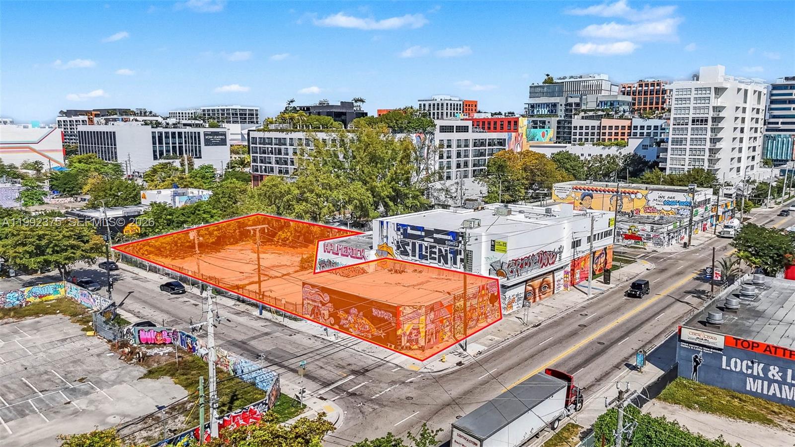 An aerial view shows a vacant urban lot and a graffiti-covered building outlined in red — 2500 N Miami Ave, Miami FL 33127, MIAMI, FL