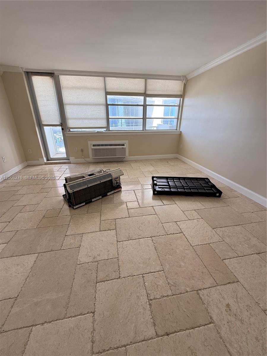 A bathroom features a black toilet, a red vessel sink, and a pebble-tiled floor — 5313 Collins Ave # 801, Miami Beach FL 33140, MIAMI BEACH, FL