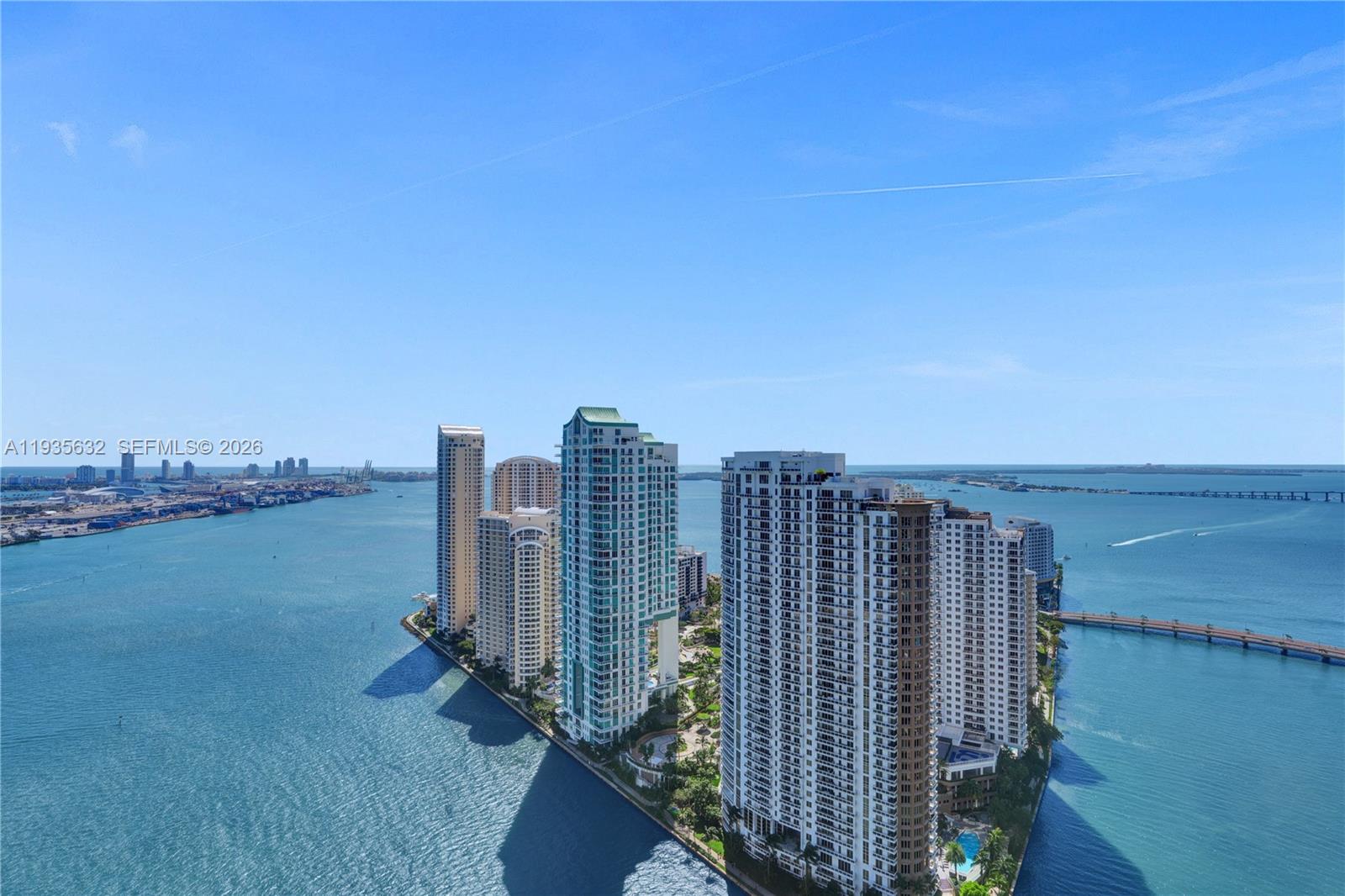 An aerial view shows several high-rise residential buildings situated on a point of land — 300 Biscayne Blvd Way # 3704C, Miami FL 33131, MIAMI, FL