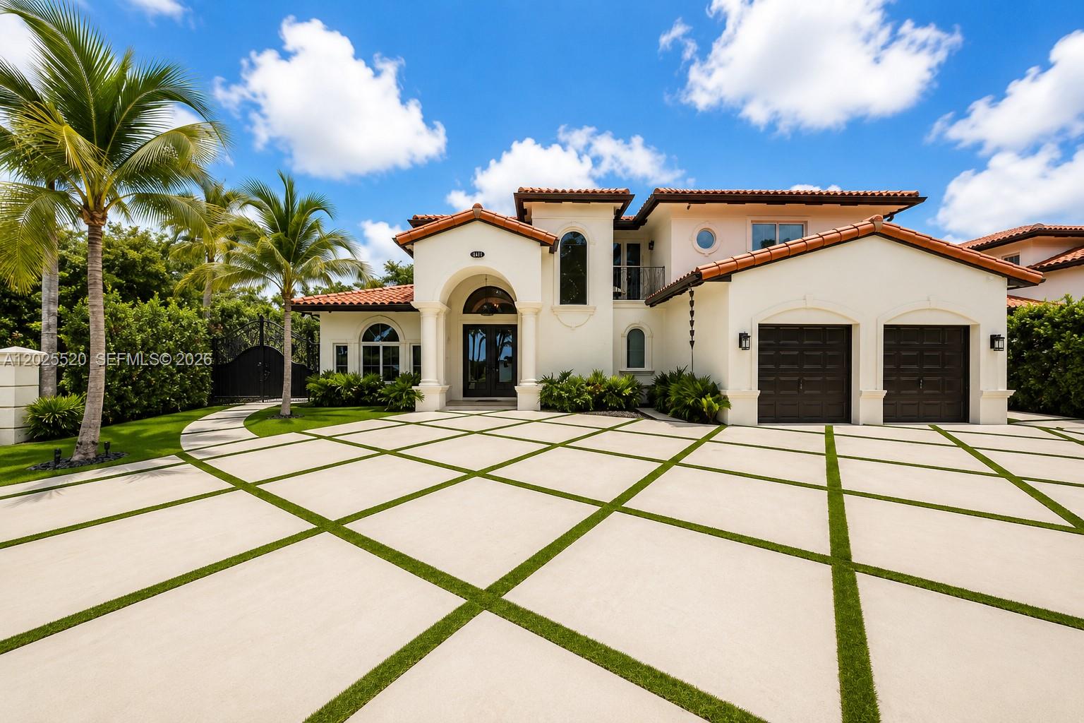 A two-story Mediterranean-style house features a large paved driveway with grass grid patterns — 15721 NW 79th Ct, Miami Lakes FL 33016, MIAMI LAKES, FL
