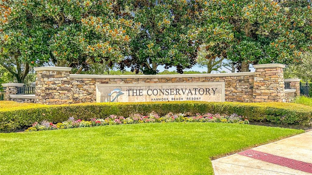 A stone monument sign for The Conservatory at Hammock Beach Resort sits before large trees — 341 HIBISCUS WAY, PALM COAST, FL