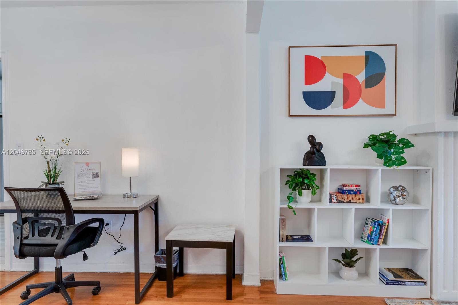 A home office area features a desk, chair, small side table, and a white bookshelf — 820 SW 26th Rd, Miami FL 33129, MIAMI, FL